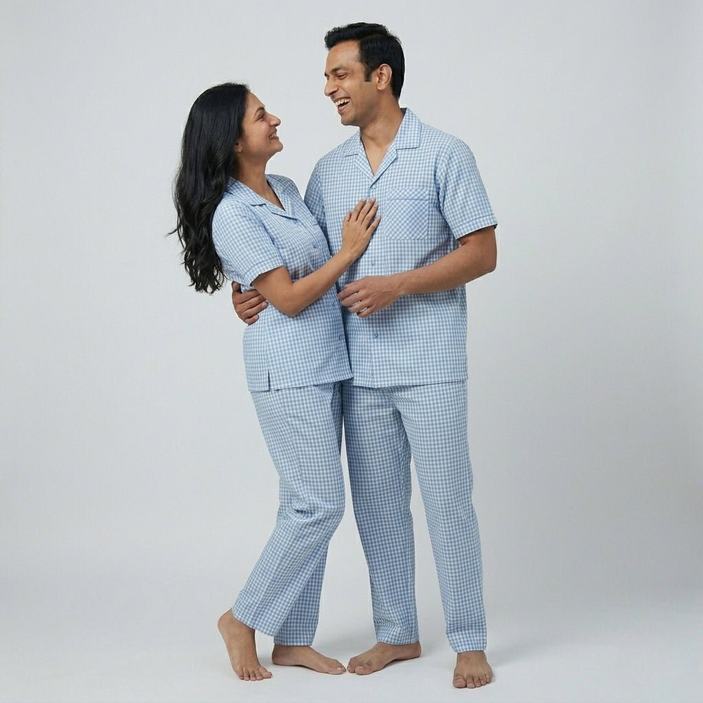 Husband and wife twinning in Powder Blue Checks night suit by Pajama Tribe