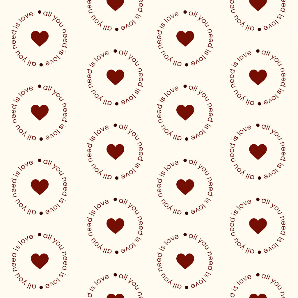 Soft cream fabric print featuring circular text and subtle heart details for pajamas