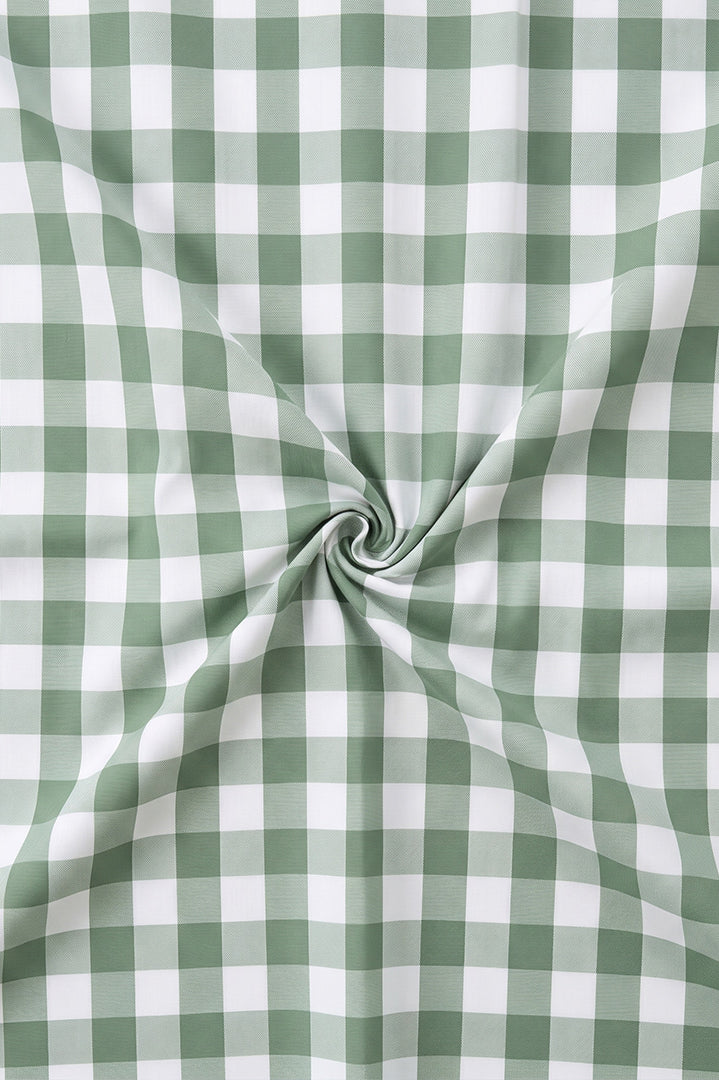 Green and white checkered fabric with a swirl pattern