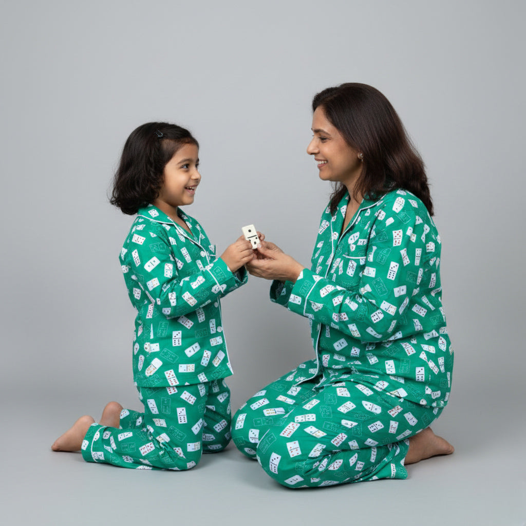 Mother and daughter in Ace of Dreams matching pajama set, fun playing-card themed print.