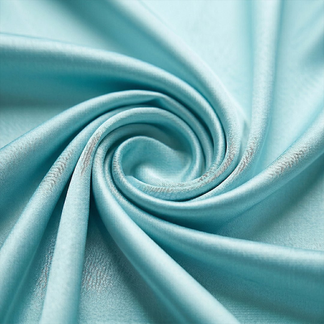 Aqua Blue Satin Vacation matching couple pajamas worn together