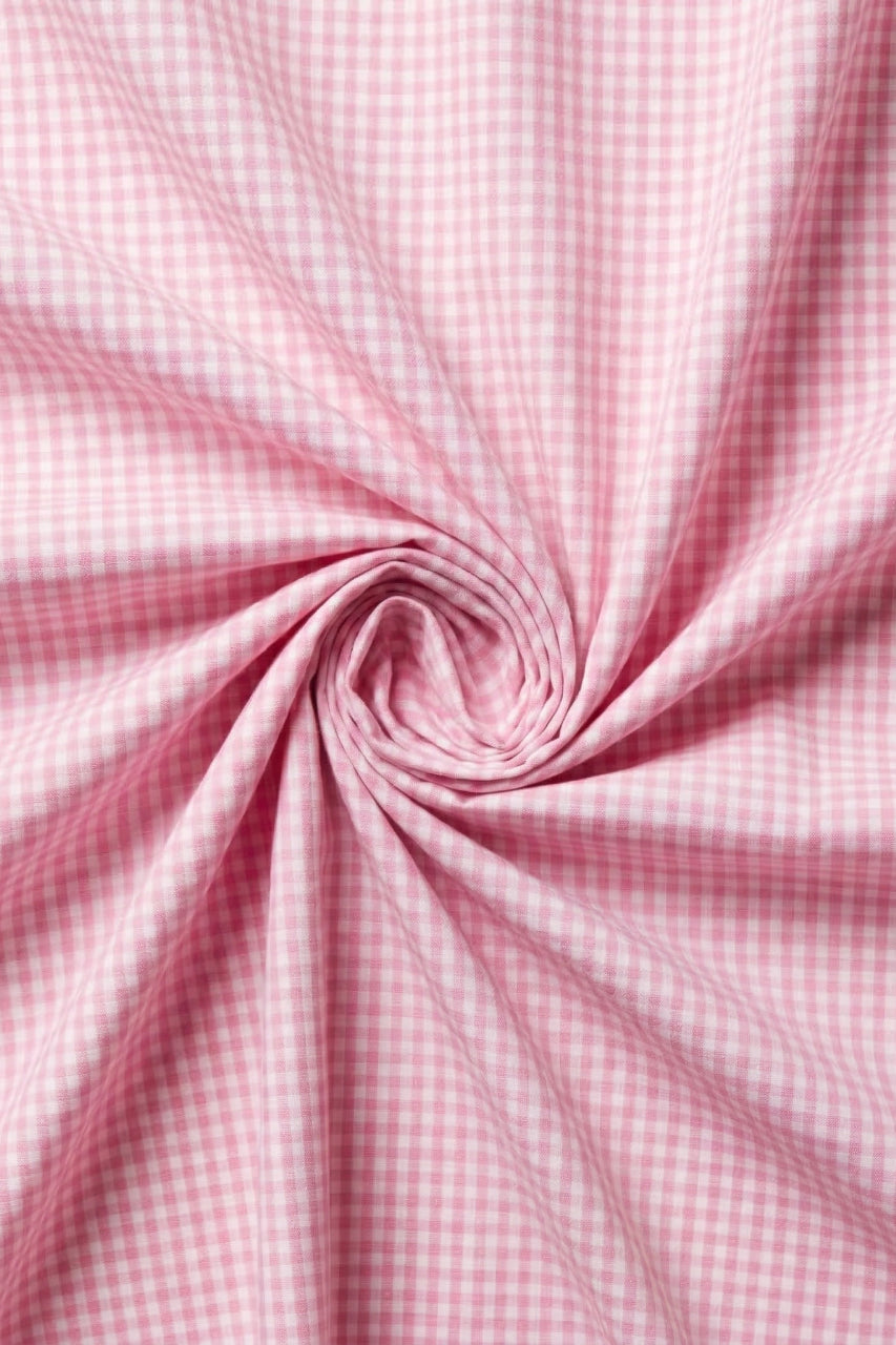 Pink gingham fabric in a swirl pattern