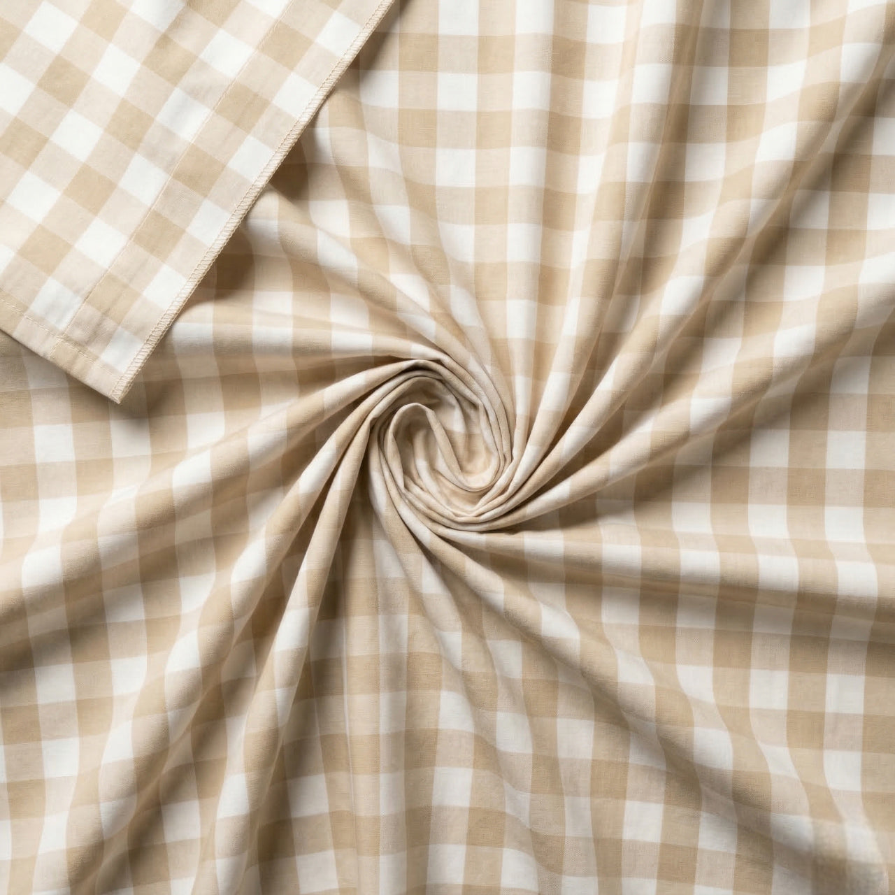 Close-up of beige and white checkered fabric with a swirl pattern