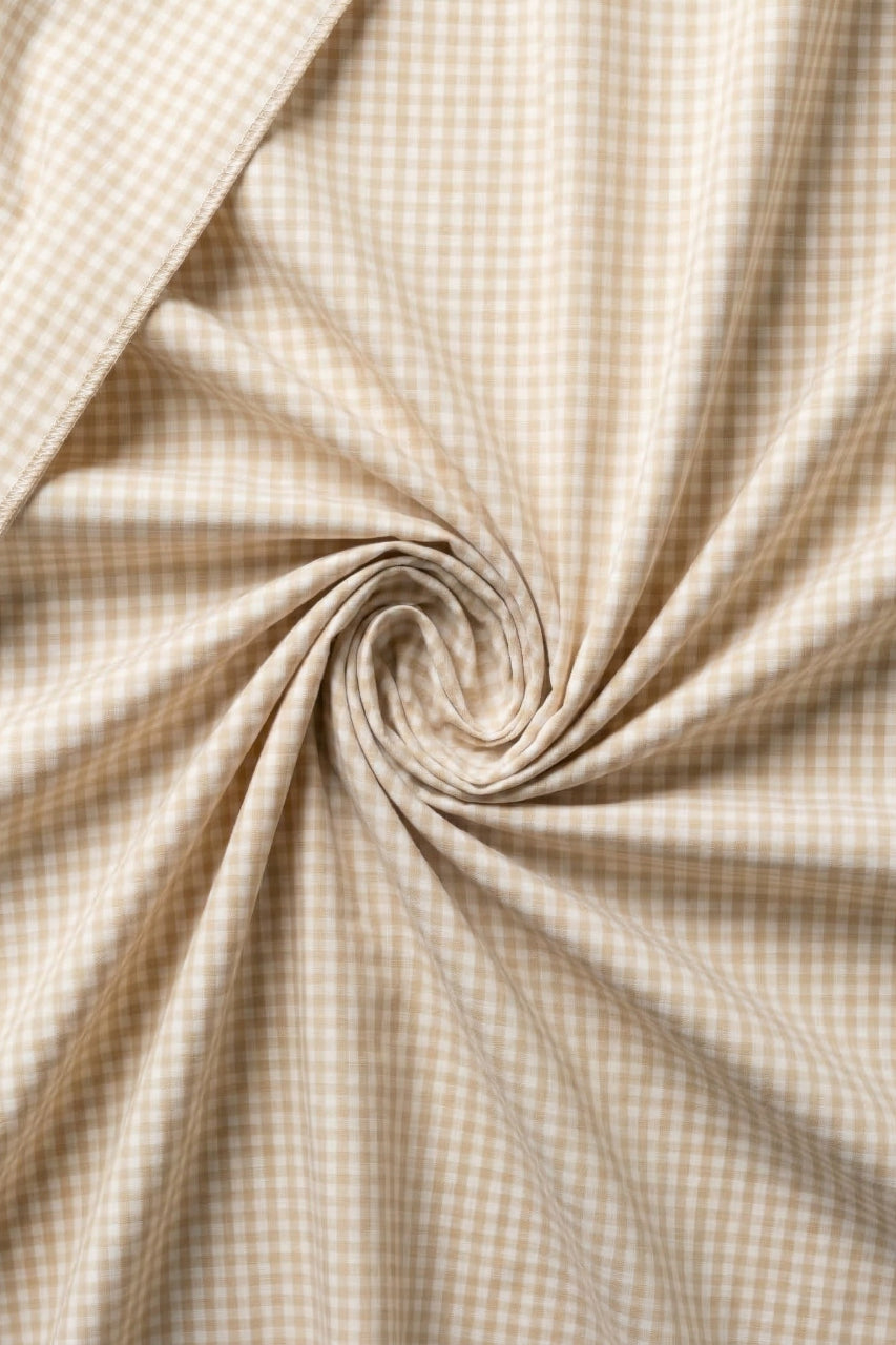 Close-up of beige checkered fabric with a swirl pattern
