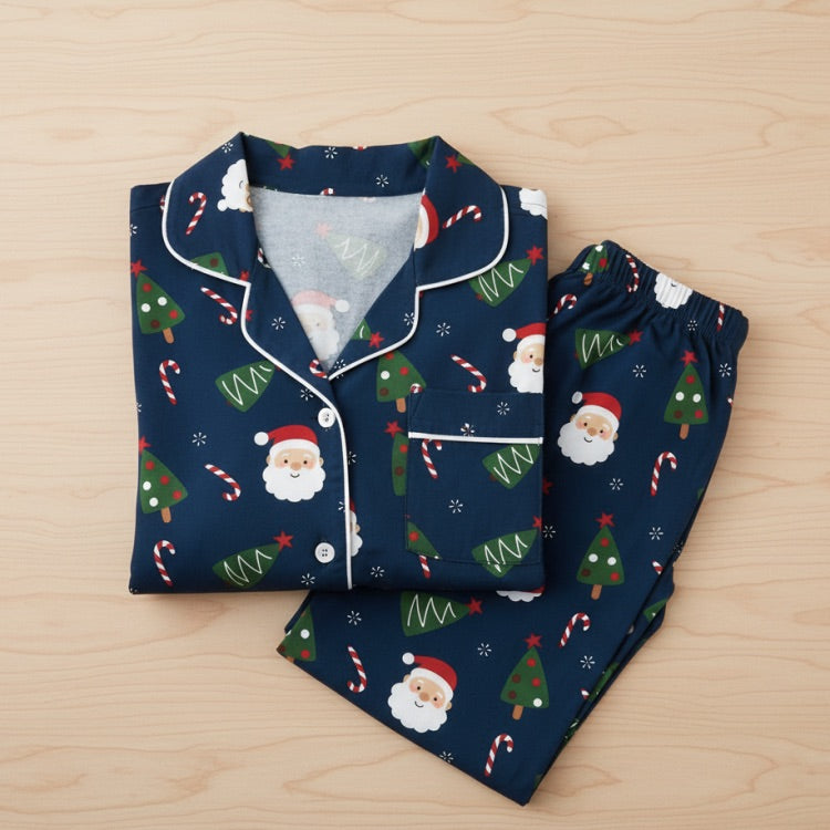 Christmas-themed pajama set with navy blue background on a wooden surface