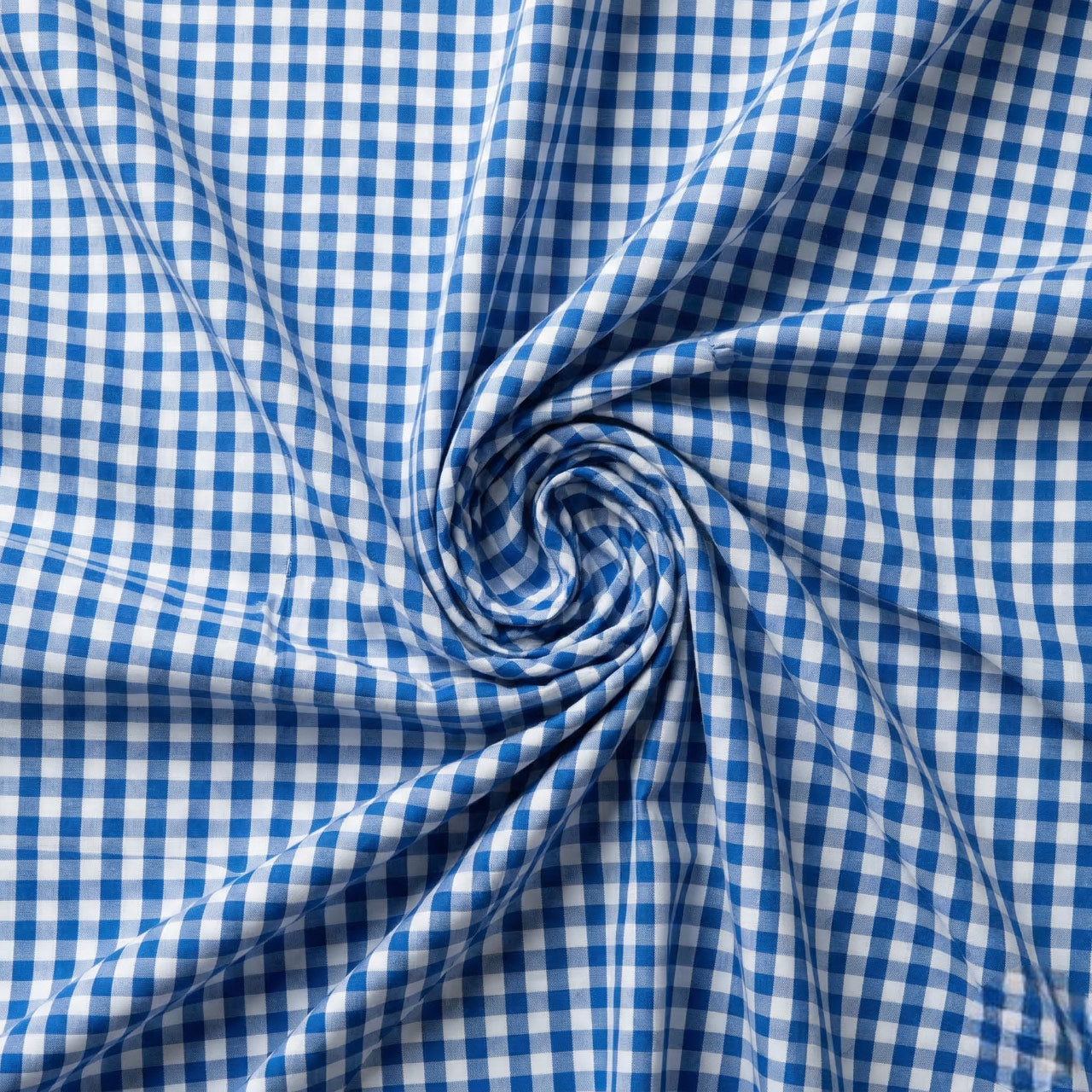 Close-up of blue and white checkered fabric in a swirl pattern