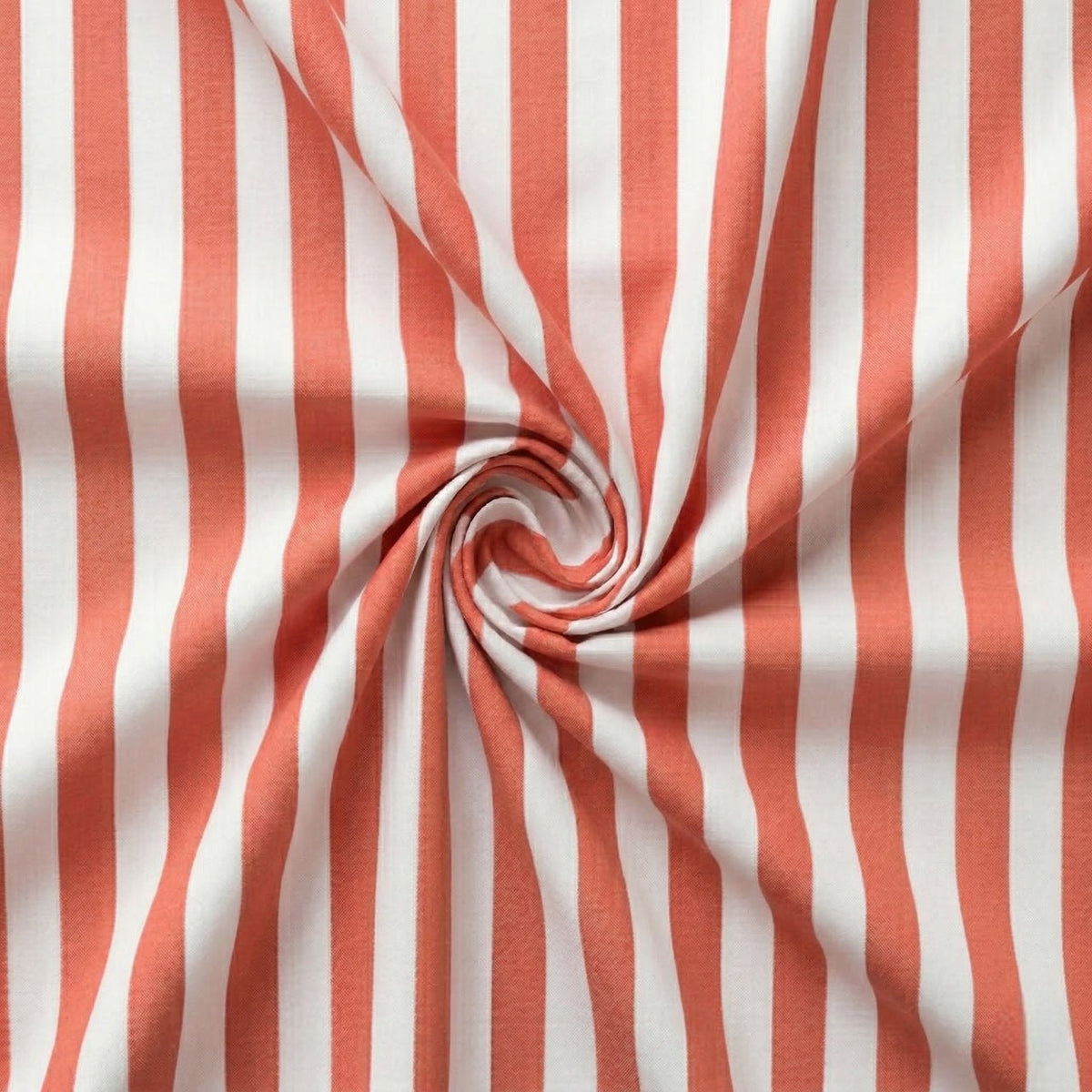 Coral red and white striped fabric in a swirl pattern