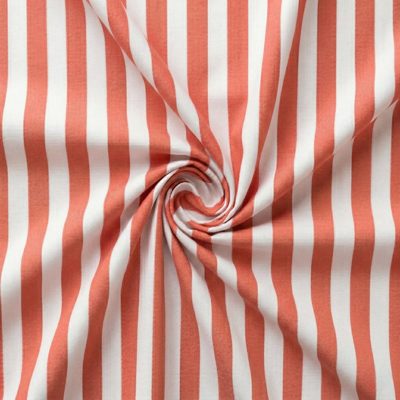 Coral red and white striped fabric in a swirl pattern