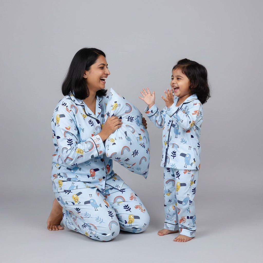 Mother and daughter in Chirpy Sleep matching pajama set, cheerful coordinated print.