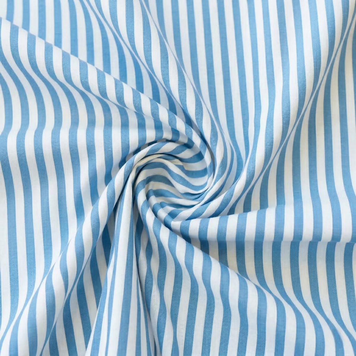 Aqua Blue and white striped fabric in a swirl pattern