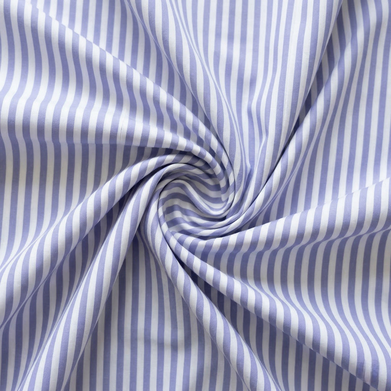 Lavender and white striped fabric in a swirl pattern