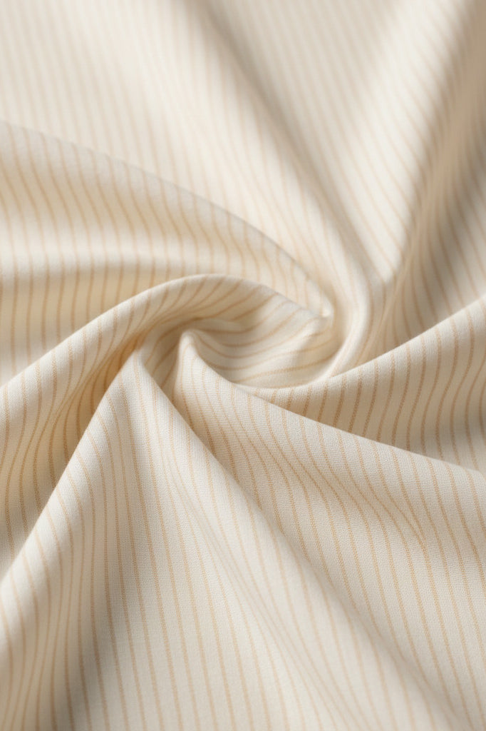 Cream cotton fabric with soft sand stripe detailing.