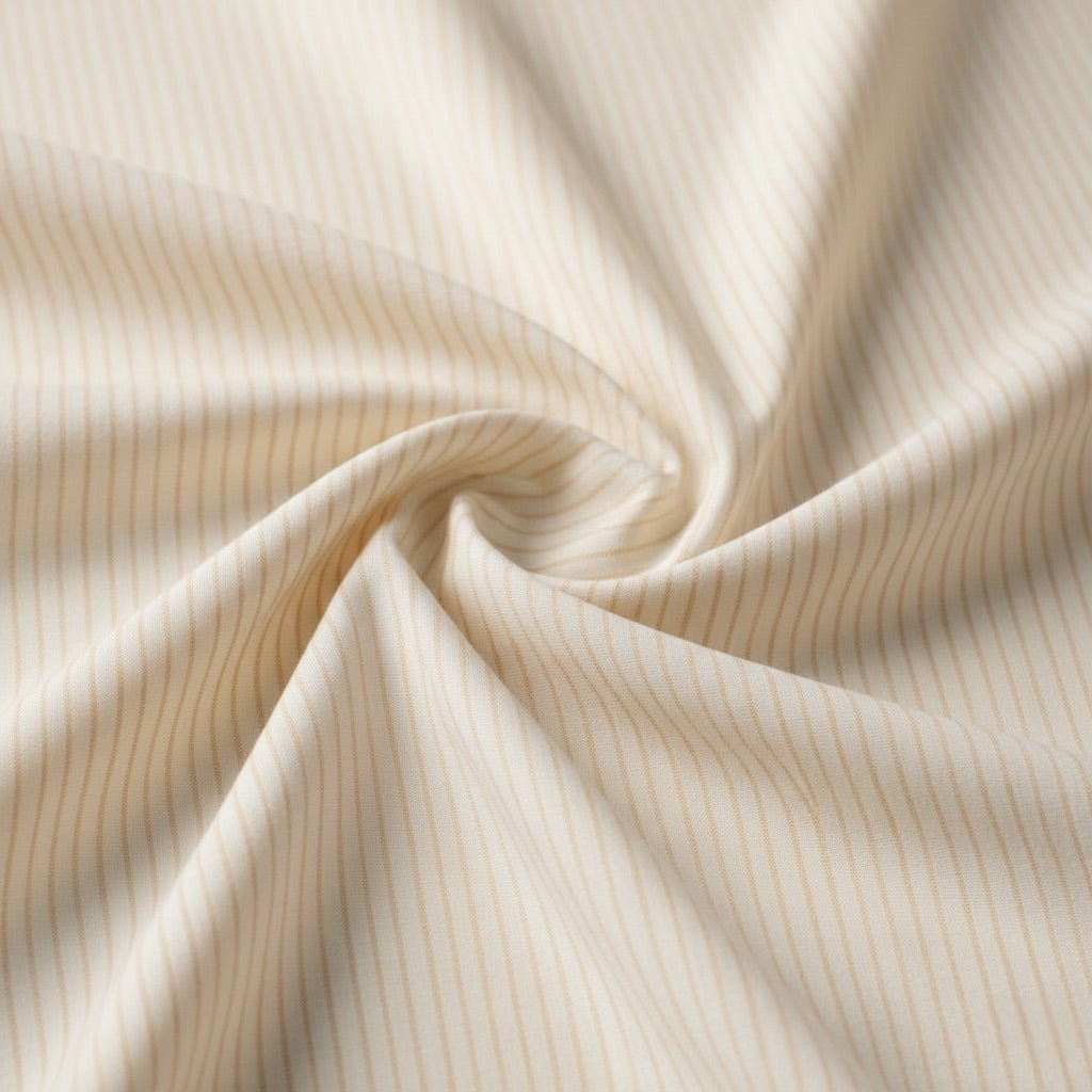 Cream cotton fabric with soft sand stripe detailing.