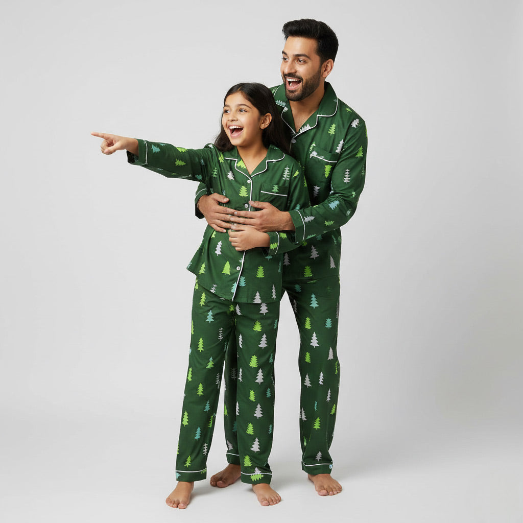 Father and daughter in Evergreen Forest matching pajama set, festive green coordinated print.