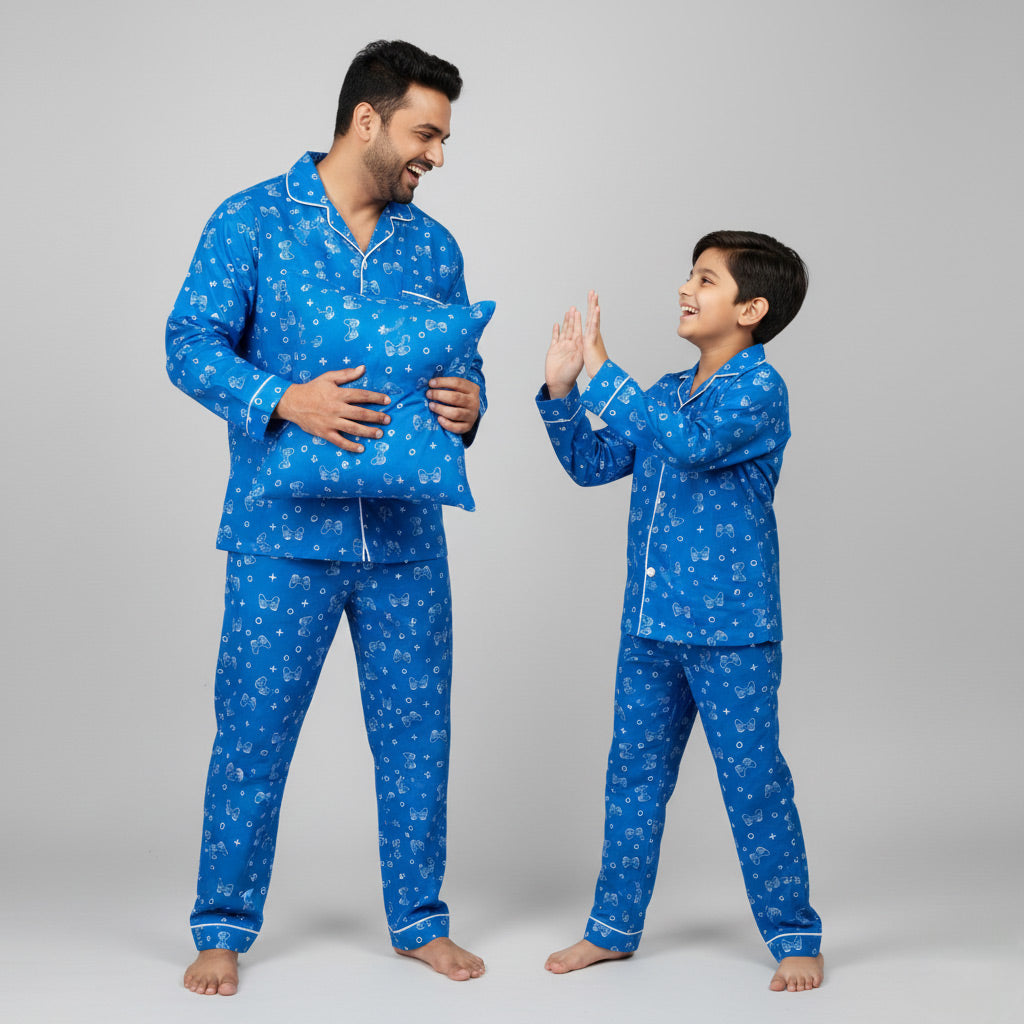 Father and son in Gamer Dreamer matching pajama set, gaming-inspired coordinated print.