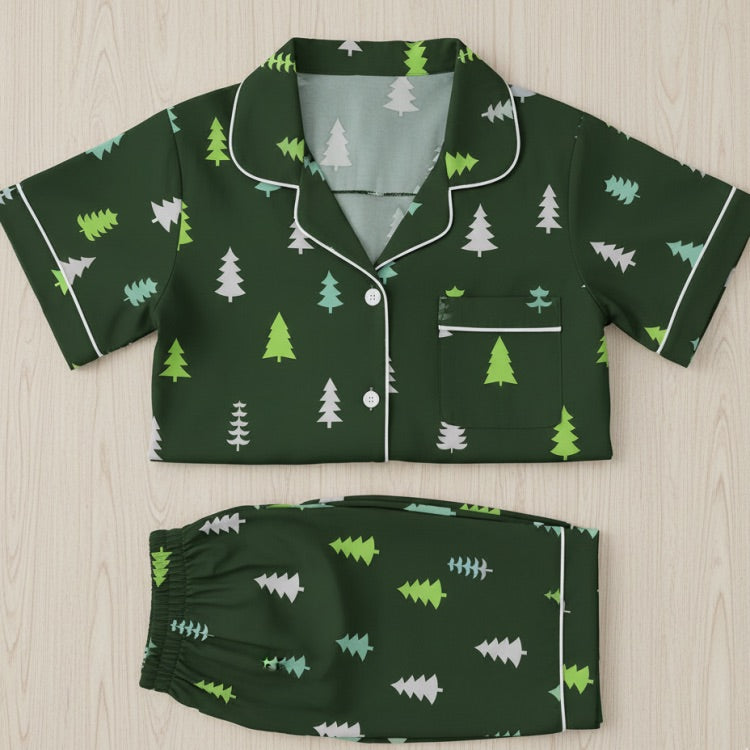 Green pajama set with tree pattern on a light wooden surface