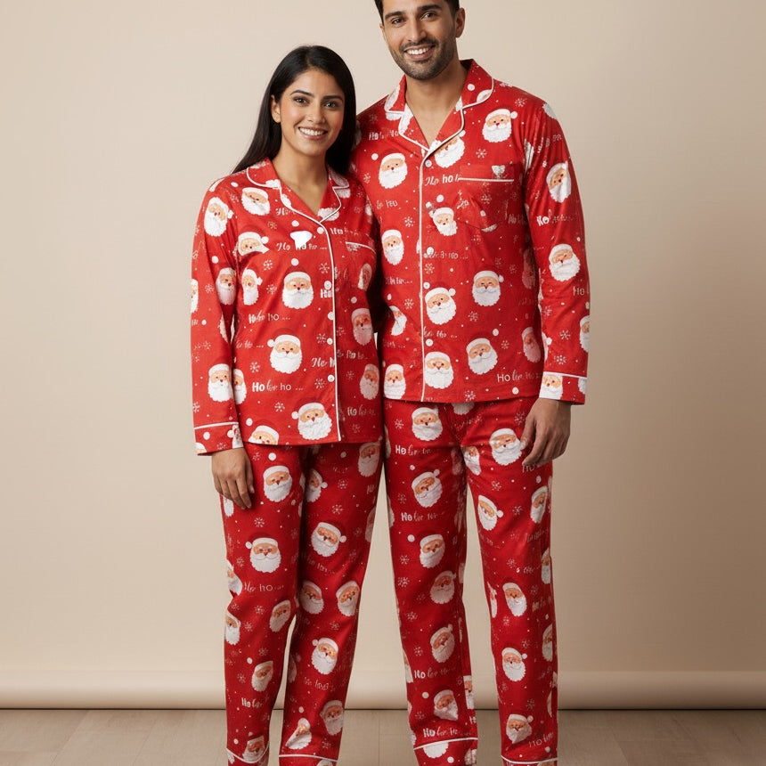 Man and woman wearing red Christmas pajamas with Santa Claus pattern on a beige background