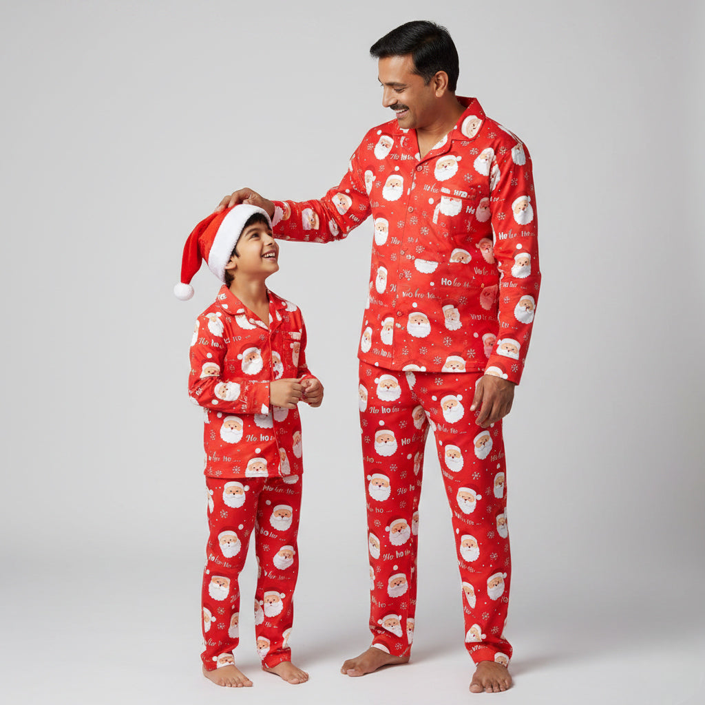 Father and son in Ho Ho Ho Santa Christmas matching pajamas, festive coordinated nightwear.