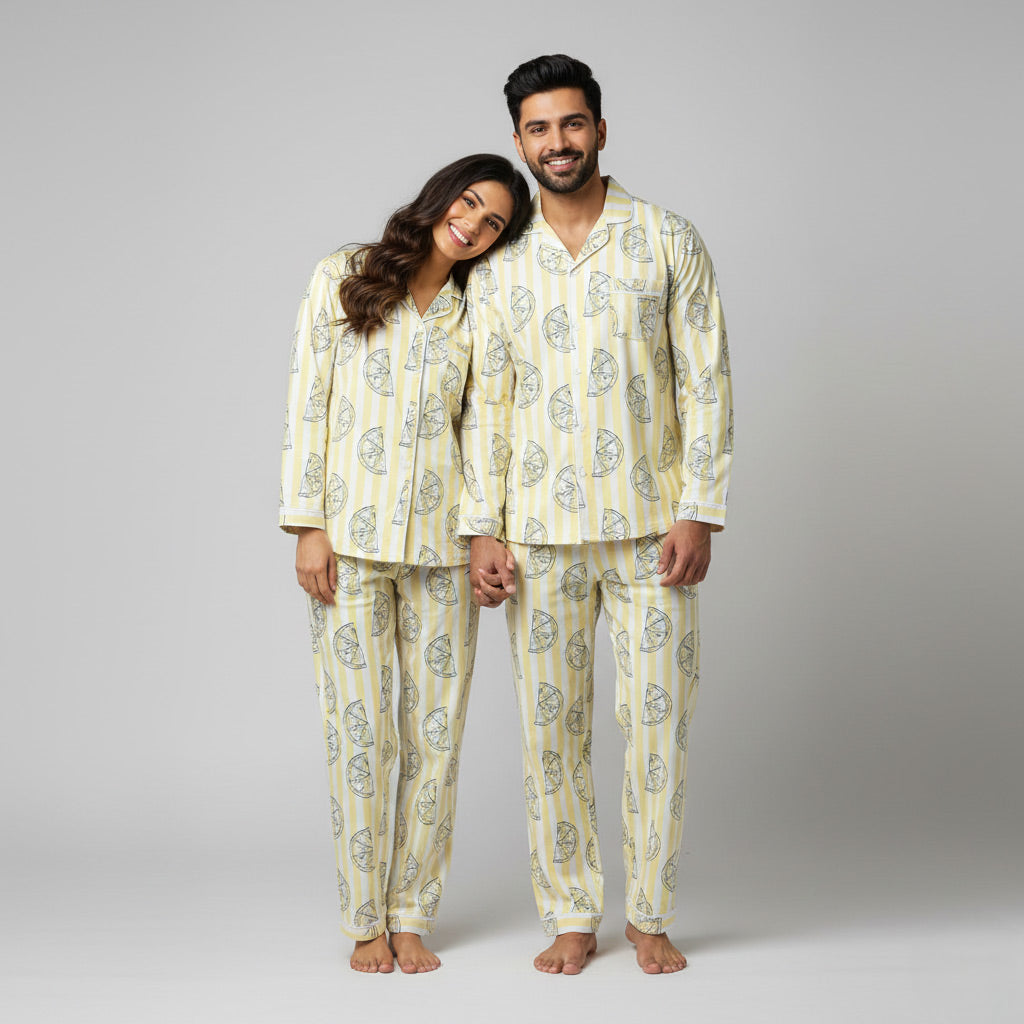 Couple wearing lemon stripes matching pajamas, fresh yellow coordinated print.