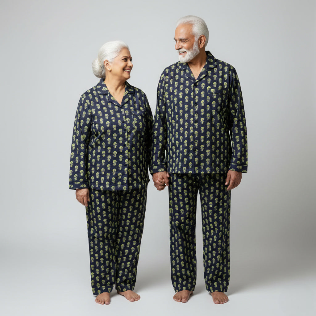 Elderly couple wearing olive motif matching pajamas, subtle coordinated design.