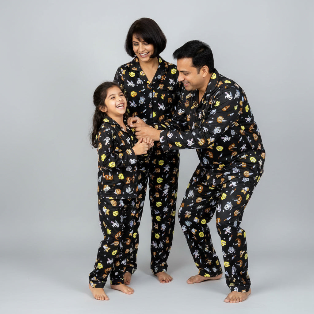 Family in owl fight matching pajama set, playful owl print coordinated clothing.