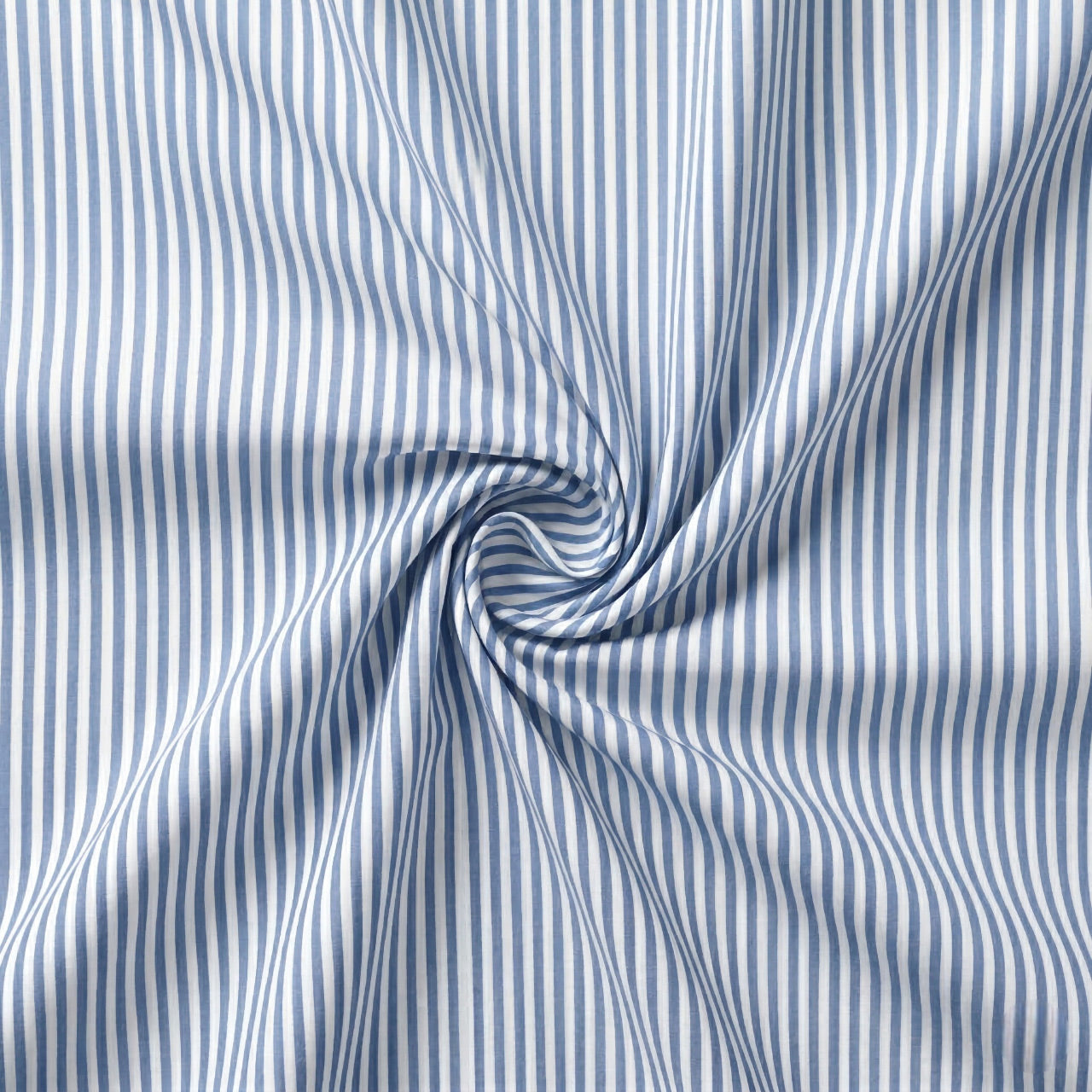 Blue and white striped fabric with a swirl pattern