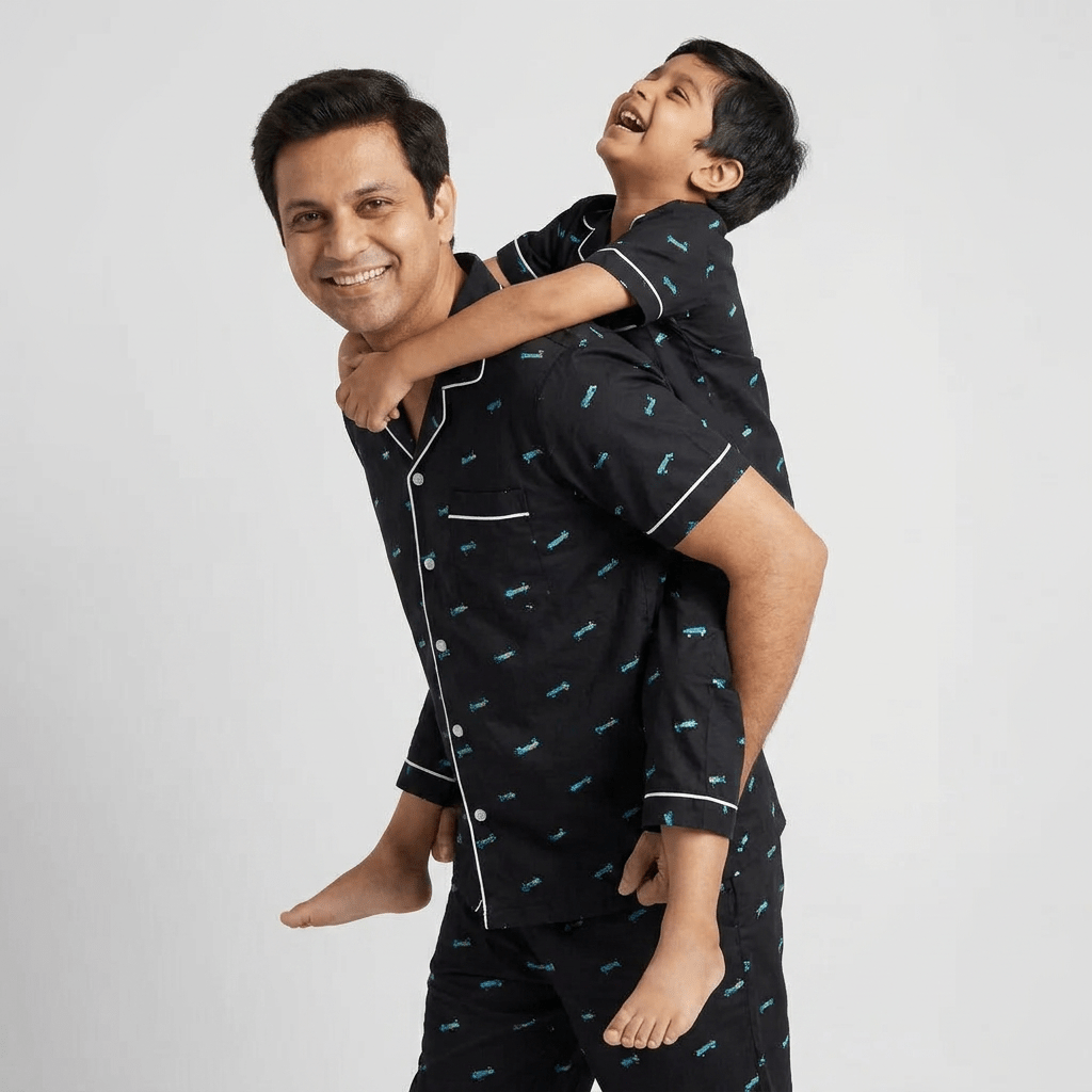 Papa and his boy twinning in Roller Board half-sleeve night suit by Pajama Tribe