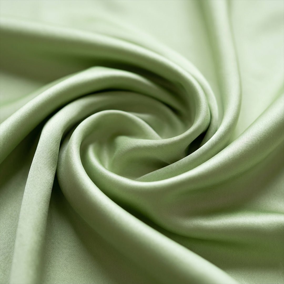 Sage Green Satin matching couple pajamas worn together