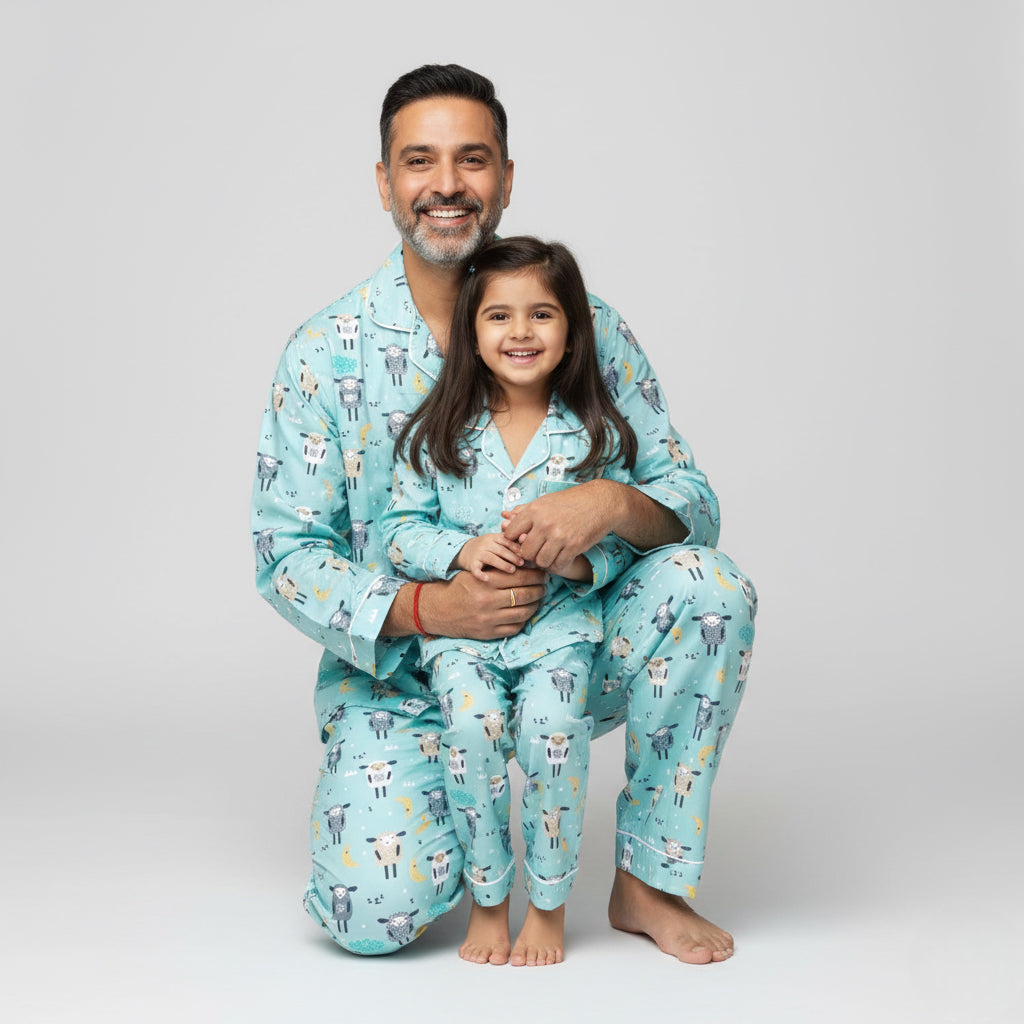 Father and daughter wearing Sheepy Head matching pajama set, smiling together in coordinated nightwear.