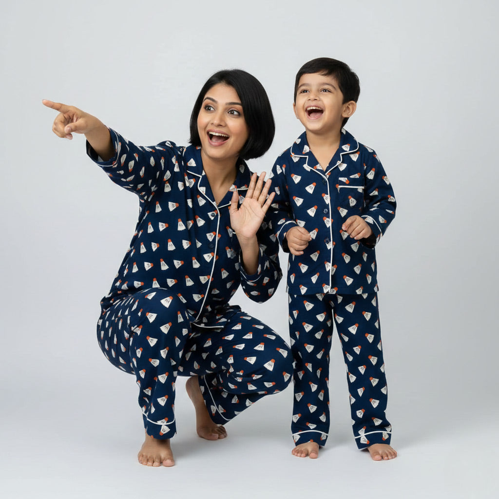 Woman and child wearing matching navy blue pajamas with shuttlecock pattern