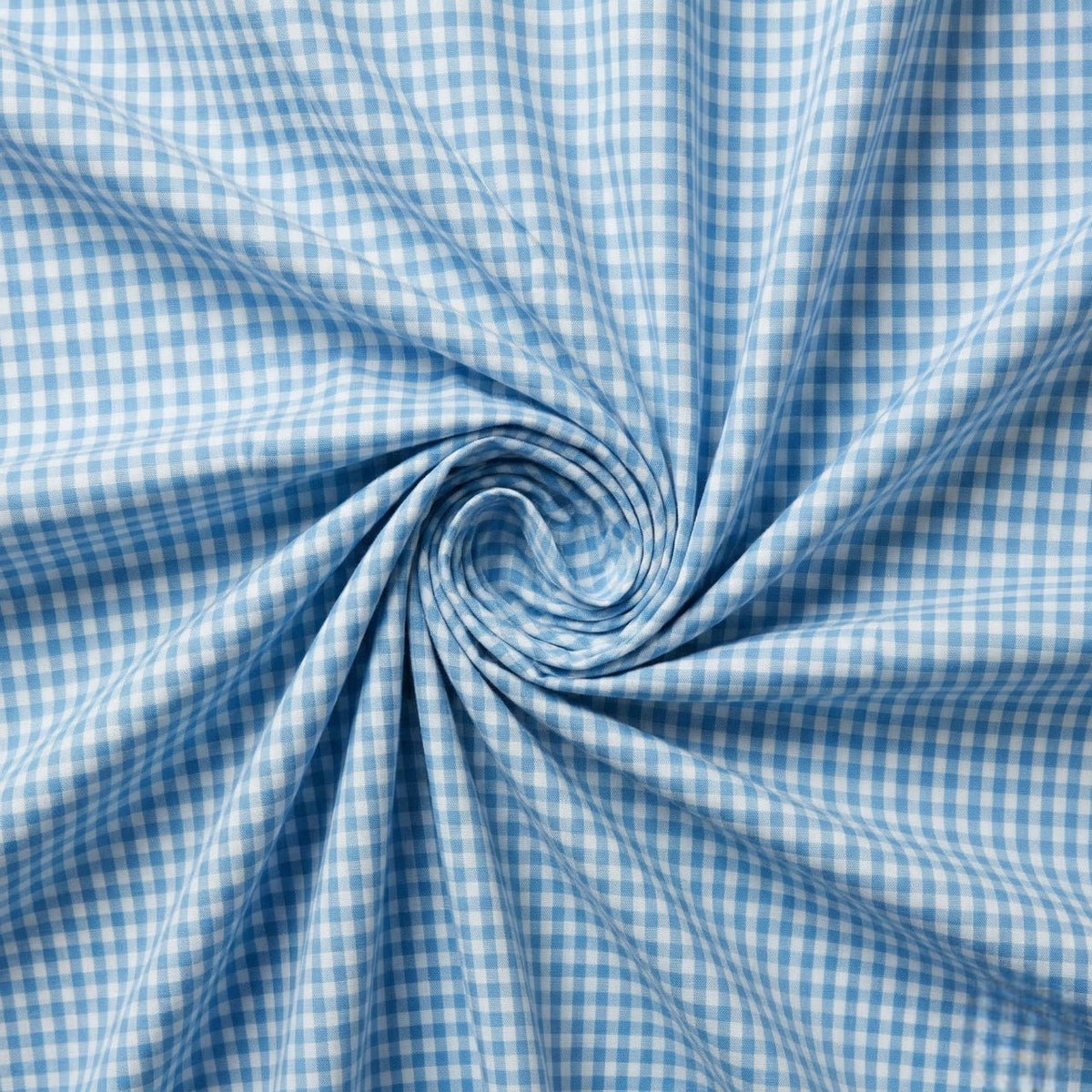 Blue and white checkered fabric in a swirl pattern