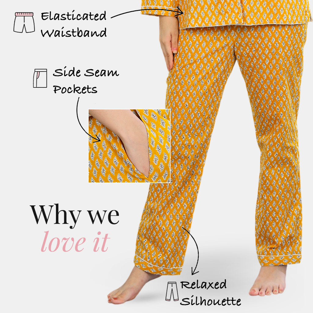 Yellow patterned pajama set with features highlighted on a white background