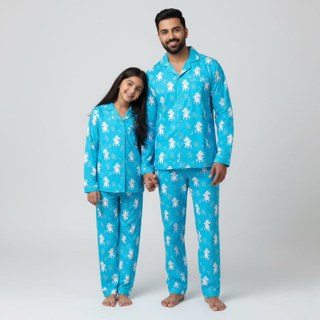 Father and daughter in Unicorn Blues matching pajama set, blue unicorn print coordinated nightwear.