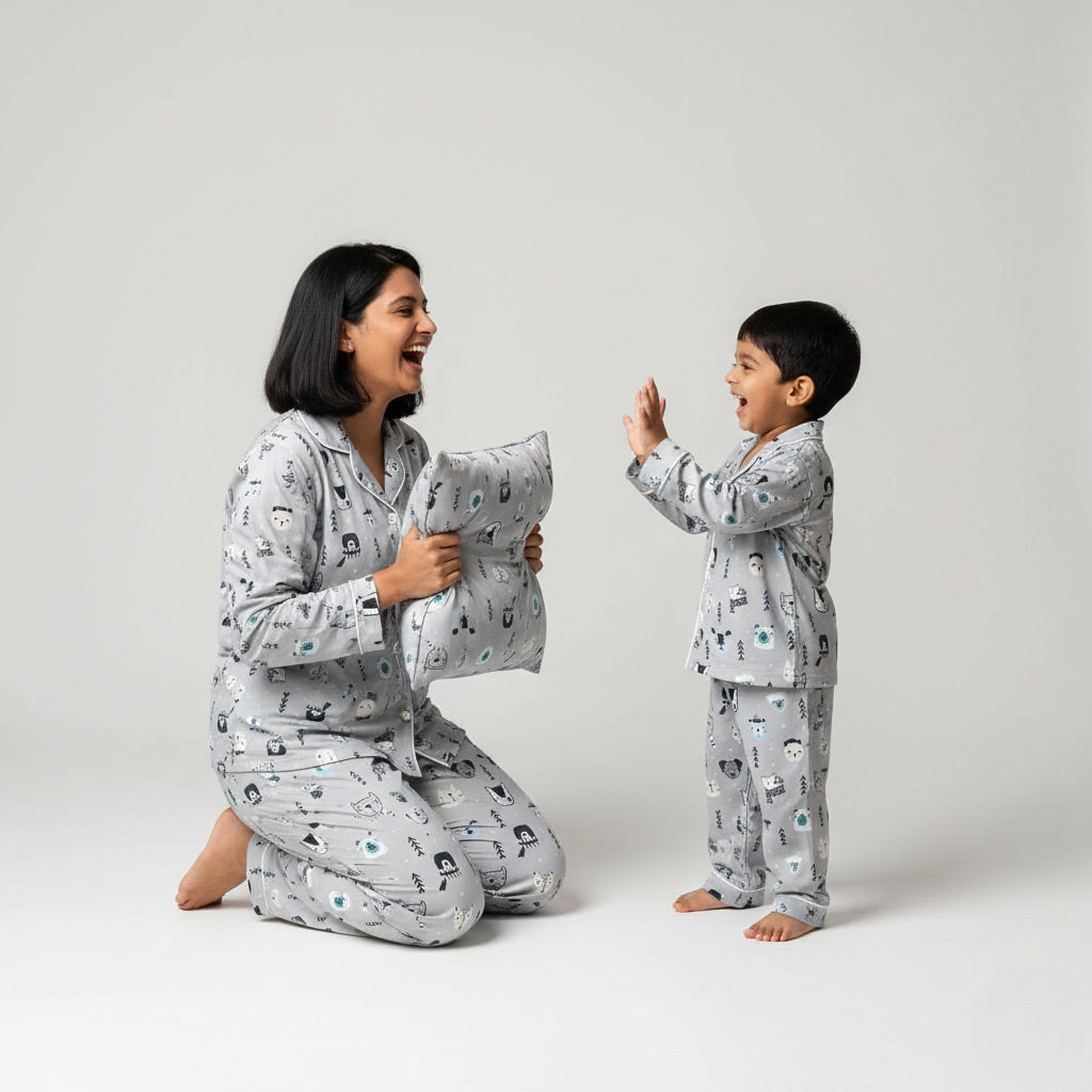 Mother and son in white fox print matching pajamas, winter-themed coordinated sleepwear.
