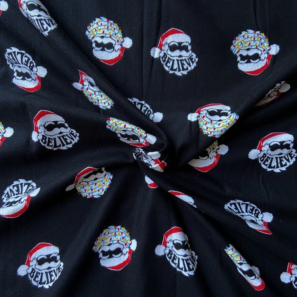 Santa Faith Print in Flannel fabric for Christmas night suits and festive family sleepwear.