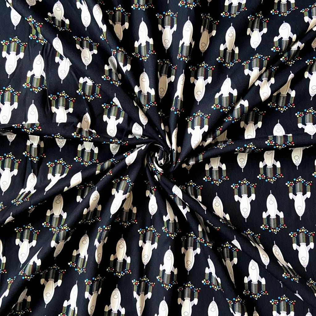Rocket print cotton fabric for space-themed night suits, kids’ pajamas and cousin sleepovers.