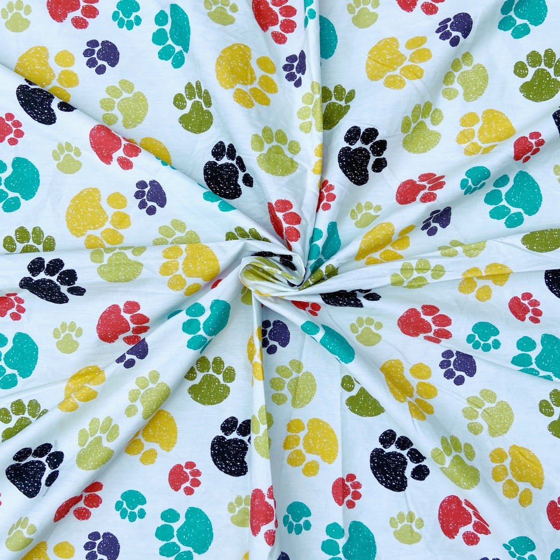 Paw Print cotton fabric for pet-lover night suits, fun kids’ sleepwear and lounge sets.