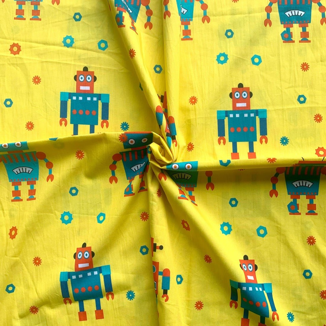 Robot cotton fabric for tech-themed night suits, boys’ sleepwear and playful loungewear.
