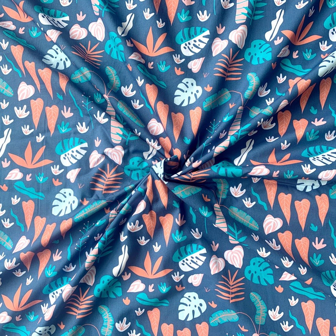 Tropical Foliage cotton fabric for leafy night suits, resort-style sleepwear and vacation lounging.