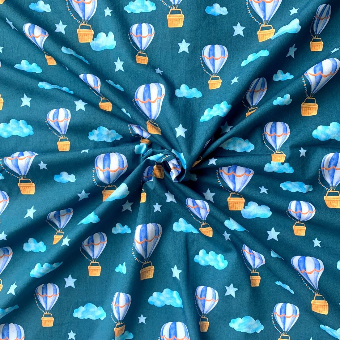 Hot Air Balloon cotton fabric for sky-themed night suits, playful kids’ pajamas and travel sleepwear.