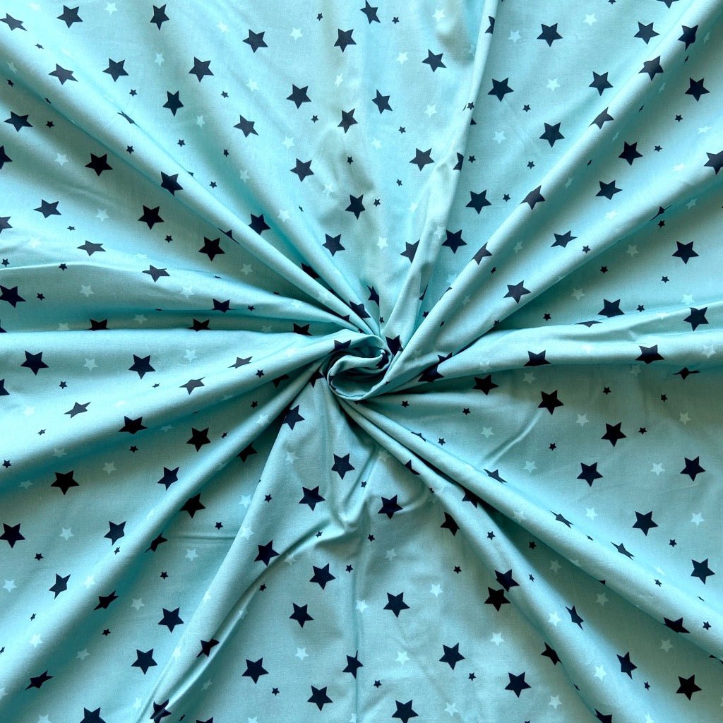 Twinkling Stars cotton fabric for space-themed night suits, kids’ pajamas and bedtime stories.