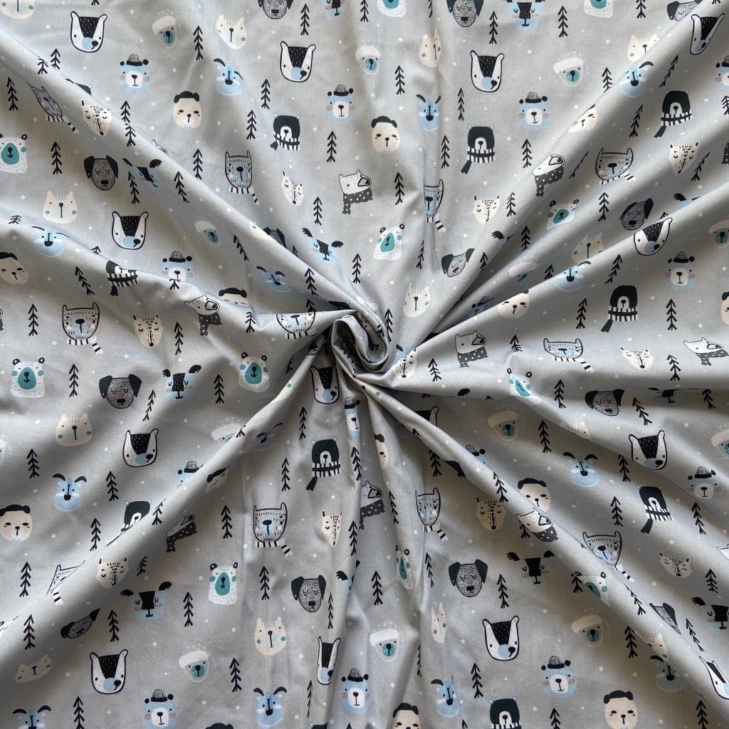 White fox in the snow cotton fabric for winter night suits and Christmas pajamas.