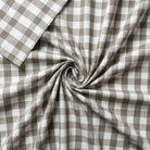 Light grey and white checkered fabric in a swirl pattern