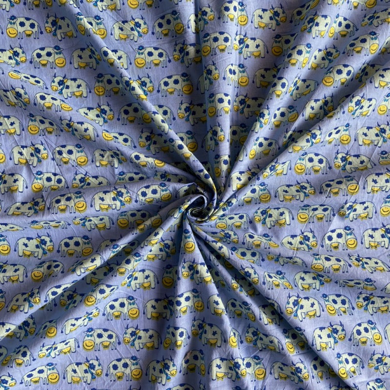 Cow print Jaipuri cotton fabric for playful night suits, quirky sleepwear and relaxed homewear.