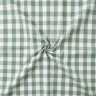 Green and white checkered fabric with a swirl pattern