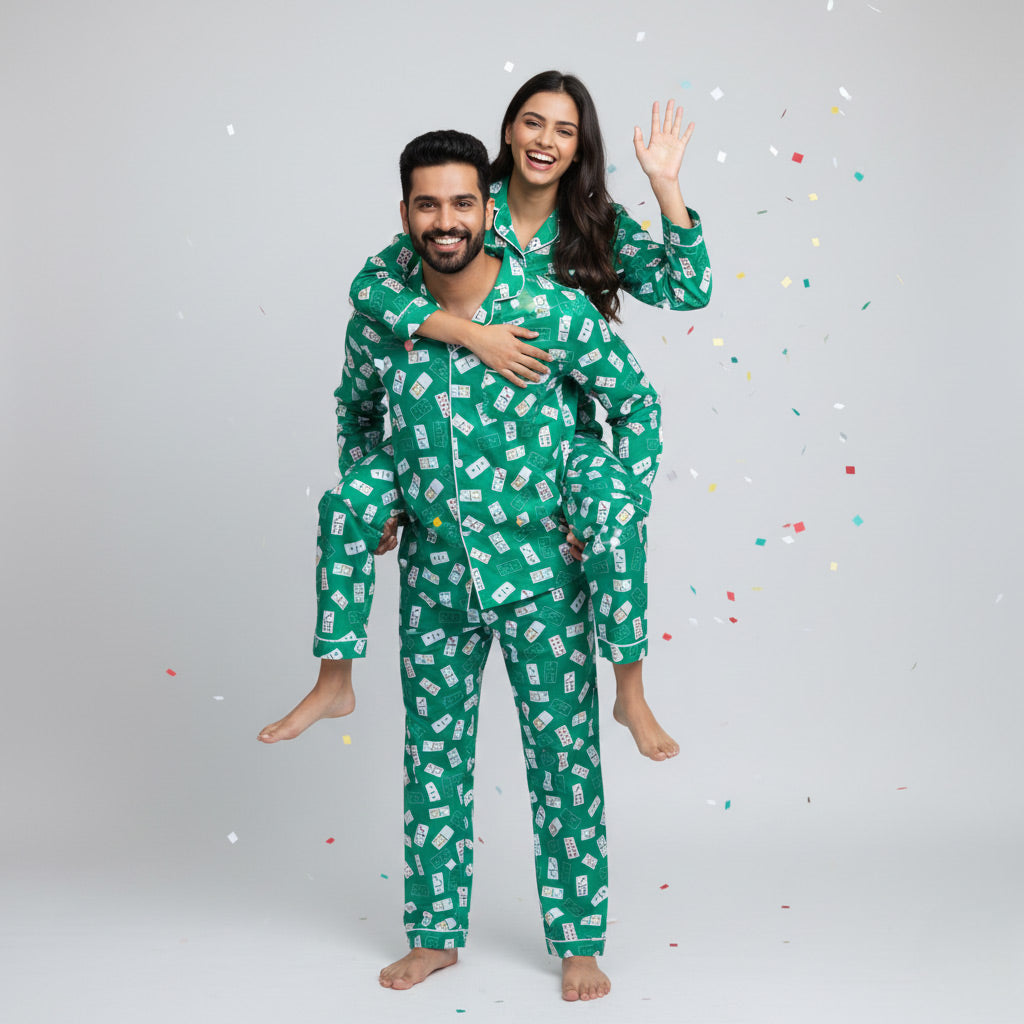 Couple in Ace of Dreams matching pajama set, playing-card themed coordinated print.