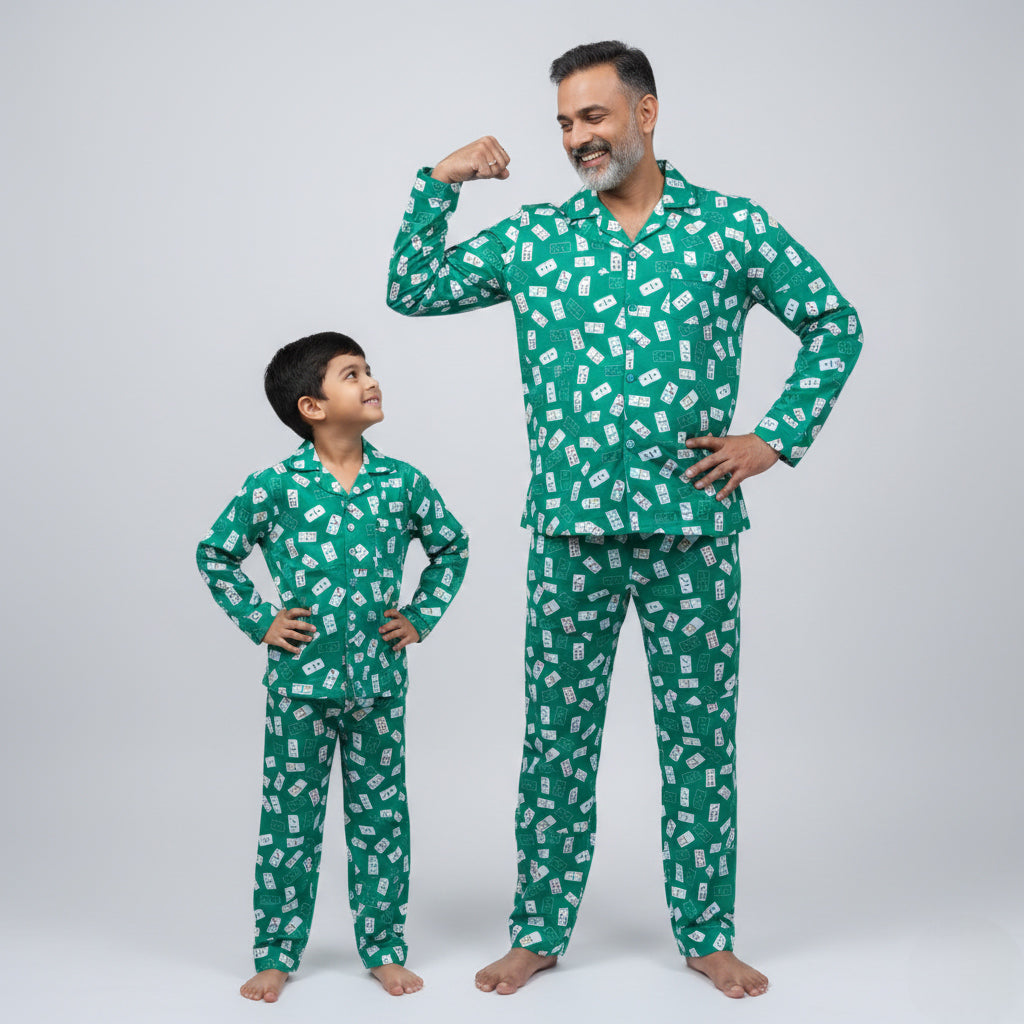 Father and son in Ace of Dreams matching pajama set, playing card themed coordinated print.