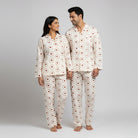 Soft cream heart print couple night suit styled as his and her matching pajamas