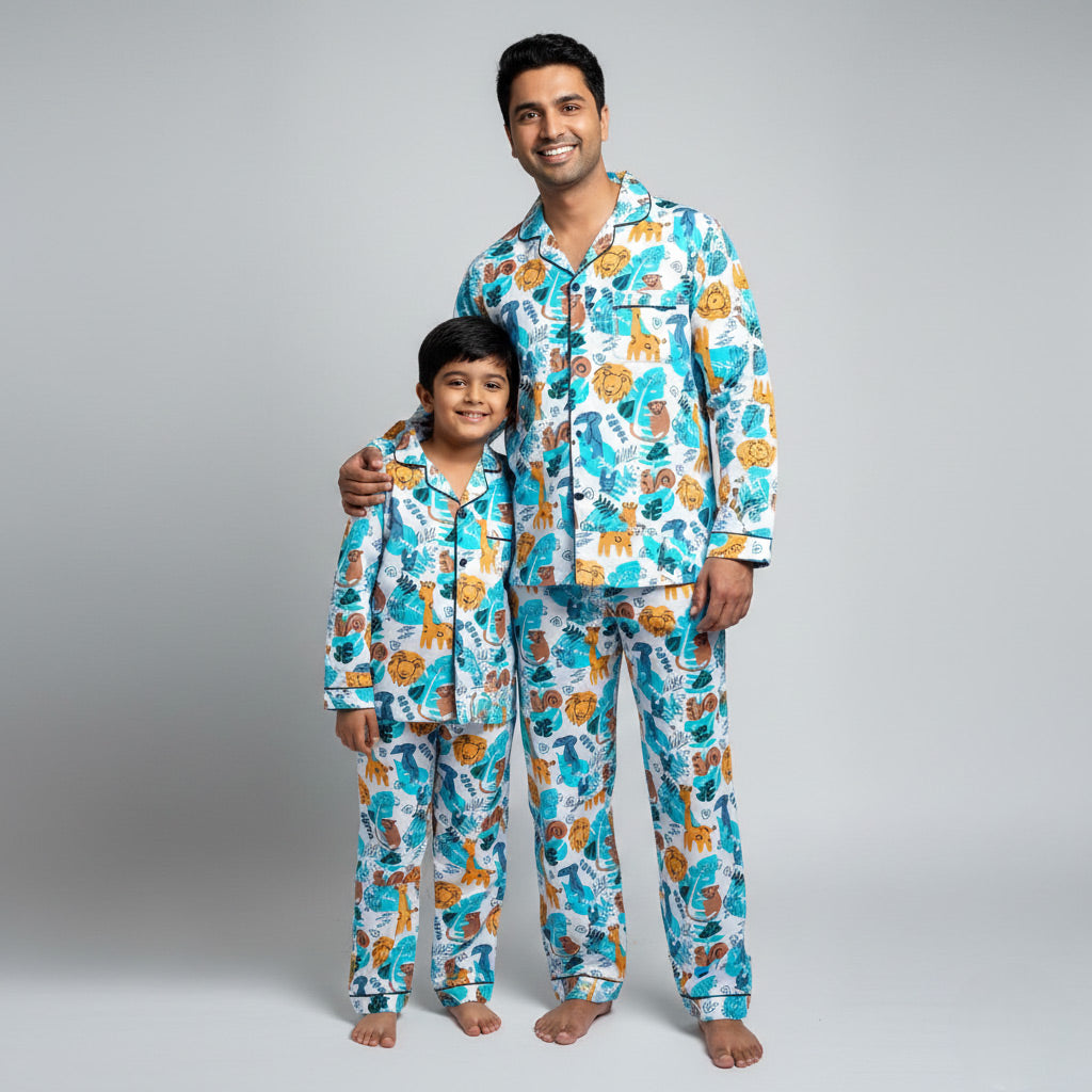 Father and son wearing Animal Tribe matching pajamas, tribal animal-themed coordinated print.