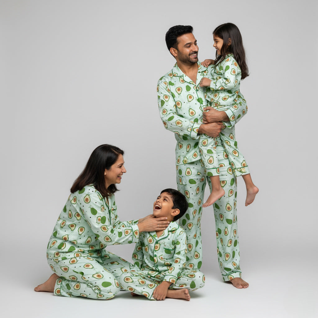 Family wearing avocado print matching pajamas, fun green coordinated outfits.
